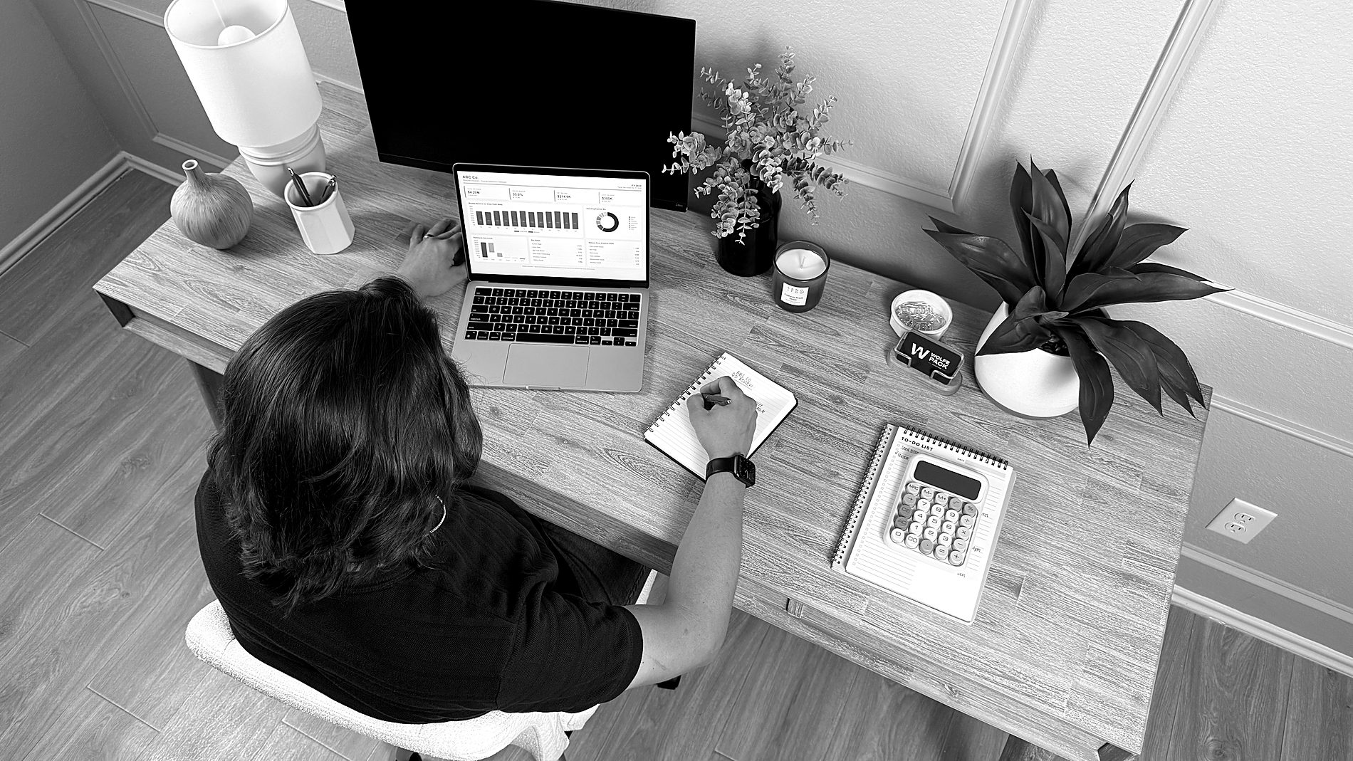 Wesley and Zoe Wolfe working together with a client's numbers